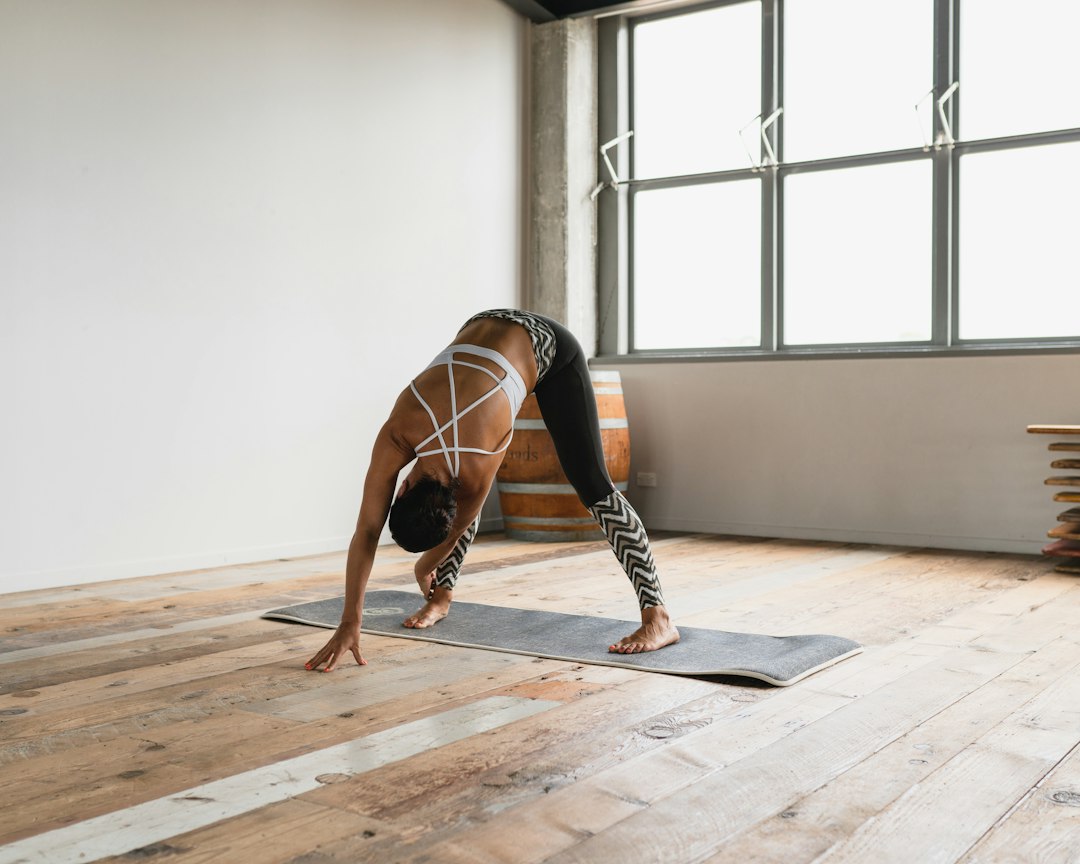 a-person-doing-a-handstand-on-a-yoga-mat-lbpmxanqocm