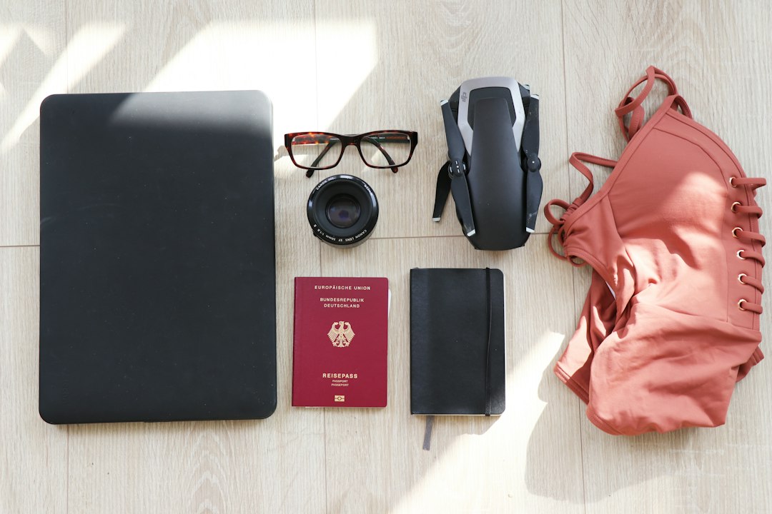 laptop-eyeglasses-passport-notebook-drone-and-swimsuit-s9ey6it86w8